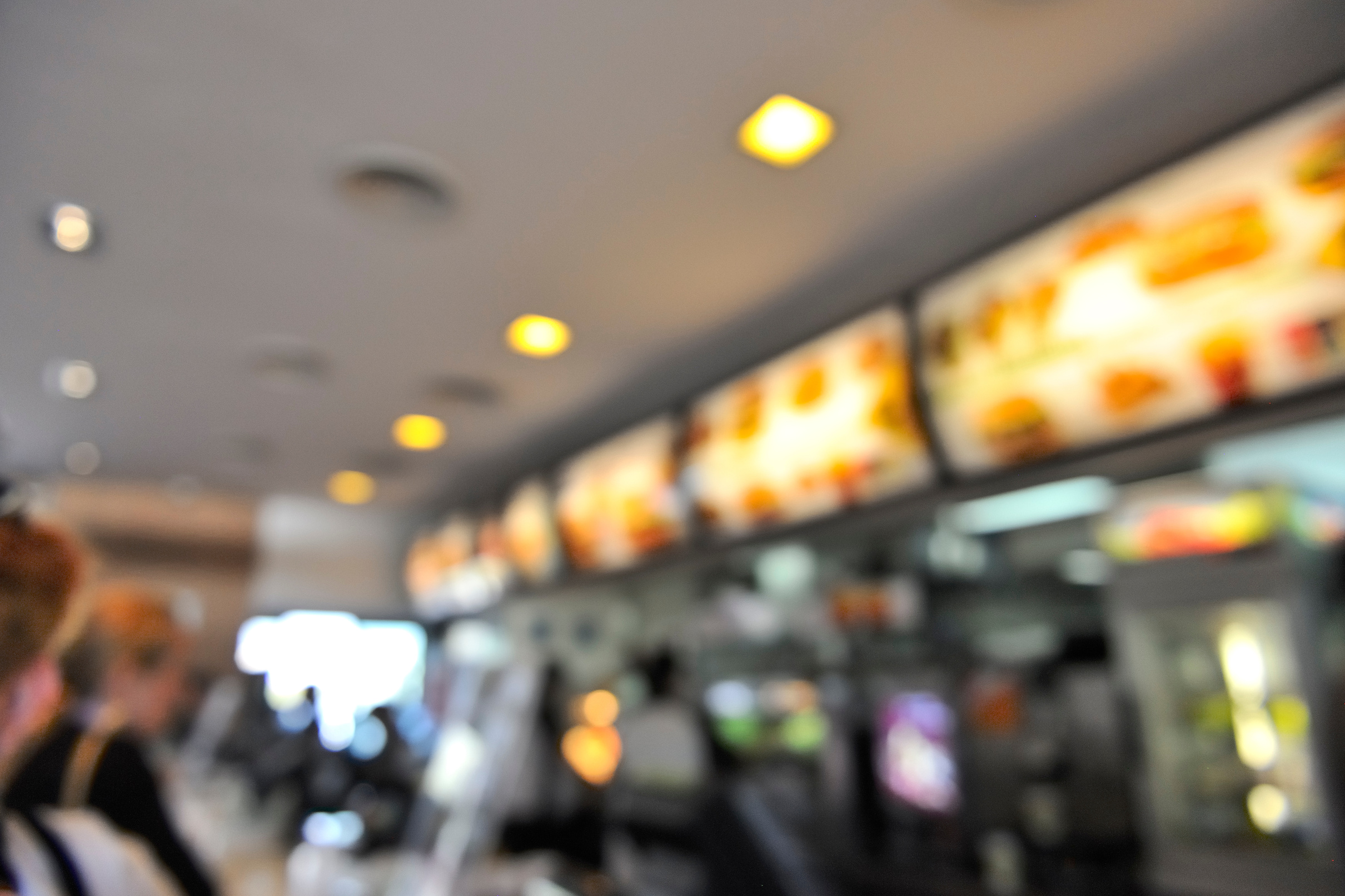Fast food restaurant interior menu bokeh background